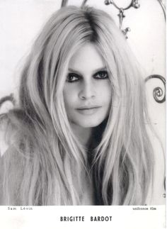 a black and white photo of a woman with long blonde hair