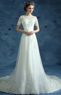 a woman in a white wedding dress standing on a blue background