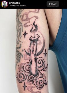 a person with a tattoo on their arm has a candle in the middle of it