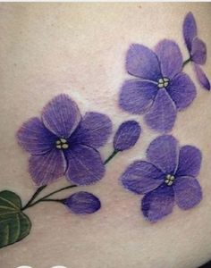 purple flowers on the side of a woman's stomach