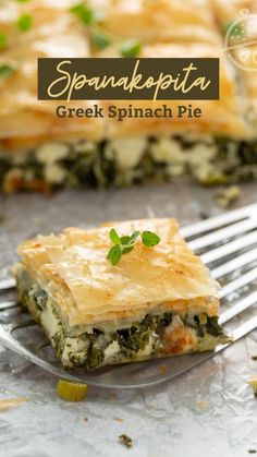 spinach and cheese pie on a plate with a fork