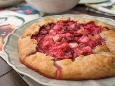 a strawberry pie sitting on top of a table