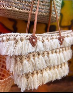 Experience the perfect blend of traditional craftsmanship and contemporary style with our handcrafted Moroccan raffia bag. This stunning piece features intricate woven patterns and eye-catching fringes that showcase the exceptional skill of Moroccan artisans. Adorned with three layers of elegant fringes, it adds a playful yet sophisticated touch to any outfit. The durable leather handles ensure comfortable carrying, making it ideal for both daily use and special occasions. Each bag is a unique c Boho Market, Grocery Bags, Raffia Bag, Shopping Trip, Grocery Bag, Leather Handle, Beach Bag, Purses And Handbags, Morocco