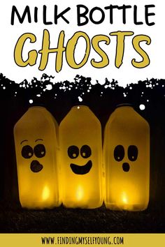 three lighted bottles with faces on them and the words milk bottle ghosts in front of them