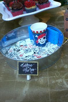 cupcakes and other treats are on display at a party