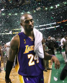 a basketball player walking down the court with confetti in his hand