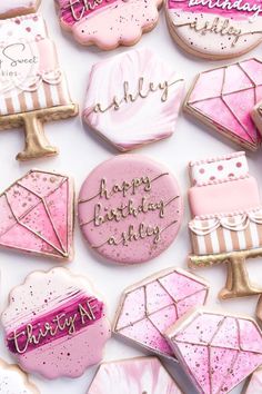 pink and white decorated cookies with happy birthday written on them