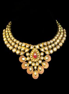 A phenomenal Enamel Kundan jewellery set that will intensify your beauty even more. Set aside a unique look for your special day wearing the splendid neck piece and the matching stunning earrings. SET INCLUDES : Necklace, earrings and tikka. Details: Handcrafted Metal: Metal Alloy, Gold Plated Stone: Enamel Closure: Post for Pierced Ears DELIVERY:• Ready To Ship• Customized Orders takes 2 to 4 weeks depending on each piece requirements. B Anu Designs Jewellery pieces can be customized in accorda Heavy Kundan Necklace In 22k Gold For Reception, Heavy 22k Gold Kundan Necklace For Receptions, Festive 22k Gold Kundan Necklace For Reception, 22k Gold Meenakari Chandbali Jewelry Sets, Meenakari Bridal Sets For Reception And Diwali, Kundan Temple Jewelry Set For Reception, Hand Set Kundan Necklace For Reception & Diwali, Chandbali Meenakari Jewelry For Reception, Meenakari Jewelry Sets For Diwali Reception