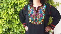 "COLOR EMBROIDERED IN BIRD AND FLOWERS MAY SLIGHTLY VARY Traditional Handmade Embroidery mexican Blouse. Ideal for a boho and vintage chic look with Folk Fabric flowers, for everyday or beach, perfect to combine with denim. Match with a Embroidery Belt for a better look. (Available in MXArtsCrafts Shop) The colors are fantastic and the weave in the fabric give it the distinct mexican flair. Super soft 100% cotton material. Sizes: All measurements were taken from a flat dimension, example: for Bu Bohemian Long Sleeve Tops With Machine Embroidery, Bohemian Embroidered Blouse With 3/4 Sleeves, Multicolor Bohemian Embroidered Long Sleeve Top, Bohemian Multicolor Embroidered Long Sleeve Top, Multicolor Long Sleeve Bohemian Embroidered Top, Bohemian Long Sleeve Blouse With Motif, Multicolor Embroidered Long Sleeve Peasant Top, Multicolor Embroidered Long Sleeve Peasant Top For Festivals, Long Sleeve Peasant Top With Multicolor Embroidery For Festival