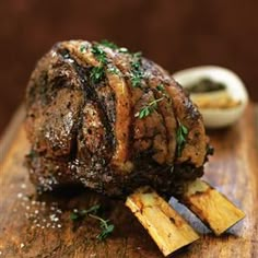 a close up of a piece of meat on a cutting board