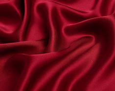 "The item is satin fabric(silk satin, silk stretch satin) of NO.13 purplish red color. If you are a professional buyer, please buy our fabric color card directly, so that the color difference between the photo color and the fabric color can be minimized. ●90 Colors Card. https://etsy.me/2OsRK8N ●Silk Fabric Sample. https://etsy.me/2KlMDXG WE COMBINE SHIPPING - Please Contact Us For Custom Order For silk satin we have 16mm, 19mm and 30mm: ●16mm thickness is the preferred fabric for pajamas, silk Red Fabric Aesthetic, Silk Material Fabrics, Silk Texture Fabric, Red Silk Background, Red Fabric Texture, Silk Fabric Texture, Satin Fabric Texture, Scarlet Red Color, Red Silk Fabric