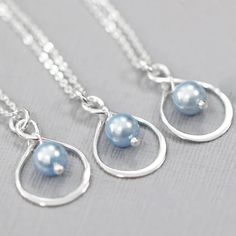 "Set of 3 Bridesmaids Gift, Infinity and Swarovski Light Blue Pearl Necklace (Available in Sterling Silver or Silver Plated Setting) Pearls also available in other colors.  Please see color chart for options. Pearl size: 6mm. Please see second photo for size reference. Necklace length:  Available in different sizes.  Please see sizing guide and select length preference from drop down list Comes with an Italian made sterling silver box necklace chain - an elegant looking chain type that does not Blue Wedding Necklace, 4 Bridesmaids, Blue Pearl Necklace, Silver Infinity Necklace, Infinity Necklace Silver, Bridesmaids Gift Sets, Light Blue Wedding, Box Necklace, Infinity Necklace