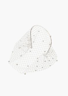 a white hat with pearls on the brim and netting covering it's face