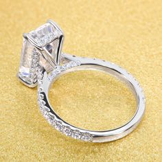 an engagement ring with two rows of diamonds on it