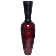 a red and black vase sitting on top of a table