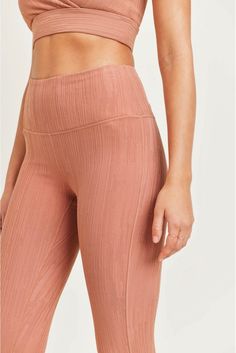 Blended fabric with textured lines pattern. These leggings cut a sleek silhouette. Place your phone in the pouch on the waistband for a hands-free experience. These leggings provide tummy control and a four-way stretch. Hiking Leggings, Pole Shorts, Graphic Leggings, Lines Pattern, Clothing Retail, Hot Yoga, High Rise Shorts, Line Patterns, The Pouch