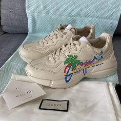 These Are A Brand New Authentic Pair Of Gucci Rhyton "Hawaii" Sneakers. A Reference To Retro Sportswear, The Rhyton Sneaker Stands Out For Its Chunky Silhouette And Oversize Sole. Features A Leather Upper Body And A Rubber Sole In Ivory. Made In Italy. Comes With Original Box And Dust Bag And Tags. Designer Low-top Summer Sneakers, Designer Low-top Sneakers For Summer, Designer Lace-up Sneakers For Summer, Designer Lace-up Summer Sneakers, Gucci Casual Custom Sneakers, Gucci Rhyton, Retro Sportswear, Shoes Gucci, Gucci Shoes