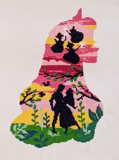 a cross stitch picture of a man and woman walking in the woods on a white background