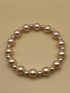 Introducing our exquisite Handmade Peach & Silver Bead Bracelet, designed to be the perfect addition to any jewelry collection.  This stunning bracelet features 10mm peach resin beads and 6mm silver spacer beads, all elegantly strung on a durable doubled elastic cord. It comfortably fits wrists sized 6.5 - 7.5 inches (16.5 - 18.5 cm), ensuring a versatile fit for most. This bracelet is an ideal gift for women and teens, perfect for birthdays, holidays, or just because. Priced at only £4.25 each, Peach Resin, Silver Bead Bracelet, Heartfelt Creations, Resin Beads, Silver Bead, Bead Bracelet, Gift For Women, Spacer Beads, Ideal Gift