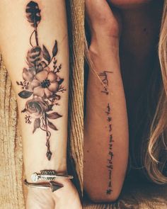 two women with matching tattoos on their arms