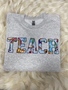 Seriously obsessed! The perfect sweatshirt for your favorite teacher ❤️ Teach Wear, Ag Teacher Outfits, Teaching Fits, Teacher Appropriate Outfits, Teach Shirt, Teacher Attire, Cute Teacher Outfits, Teacher T Shirts, Teacher Wardrobe