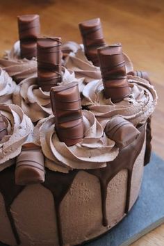 a cake with chocolate icing and lots of frosting on it's top