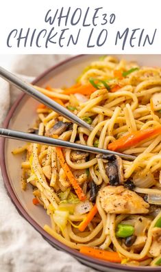 a plate full of noodles with chicken and vegetables