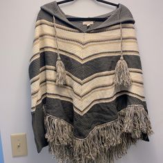 Bought It Here On Poshmark But Don't Find Myself Wearing It. Perfect Condition. It Did Have A Tag When I Got It But I Removed It Prior To Washing (In Cold Water). Washed Only One Time. Never Worn. Warm, Cozy, And Perfect For Chilly Days. Questions? Leave A Comment Below! Beige Hooded Poncho For Fall, Casual One Size Knit Poncho, Casual Beige Knitted Poncho, Casual Knit Poncho, Grey Poncho, Hooded Poncho, I Got It, Shrug Sweater, One Time