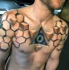 a man with an all seeing tattoo on his chest