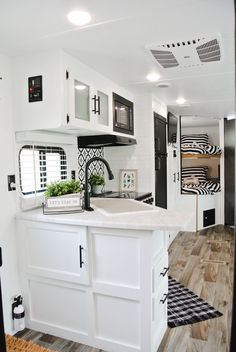 the kitchen is clean and ready to be used as a living room or dining area