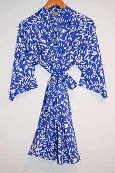 Short cotton kimono robe with stitched placket detail and pockets. Matching Belt, interior ties, and hanging loop at inside neck. 100% lightweight cotton | hand block printed in Jaipur, India Size S/M: 34" length | 15" sleeve length | 53" total body width Size L/XL: 36" length | 16" sleeve length | 62" total body width Machine wash cold water, delicate cycle | Air dry Cotton Bathrobe, Cotton Kimono, Jaipur India, Total Body, Gorgeous Gift, Kerala, Air Dry, Jaipur, Printed Shorts