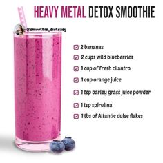 a pink smoothie in a tall glass with blueberries on the side and information about it