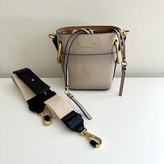 Chloe Roy Small Gray Patent Leather Bucket Crossbody 2 Way Bag! Description: Such A Casual Chic Design By Chloe! Perfect Year Round Option:) Color: Gray Condition: Like New. No Scratches On Leather. Guaranteed Authentic Details: Taupe Gray Shade, Patent Leather Exterior With Logo, Structured Shape, Dark Beige Fabric Interior W/Leather Drawstring Closure, Tonal Stitching, Extra Handle Strap, Sporty Beige/Black Leather Detachable Shoulder Strap, Matte Goldtone Hardware W/Etched Logo, Gold Studded Bottom. Note: Minor Interior Stains. Overall Gorgeous!!! Without Dust Bag. Measurements: Approx. 5.5"W X 7"H X 3.5"D Made In Italy Note: Final Sale, No Returns. Please Email Any Questions Befor Bag Measurements, Beige Fabric, Dark Beige, Leather Bucket, Chloe Bag, 2 Way, Gold Studs, 7 H, Chic Design