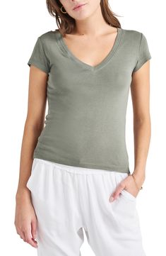 Achieve a casual-cool vibe in this soft cotton-blend T-shirt designed with a dipped neckline and abbreviated sleeves. 23 1/2" length (size Medium) V-neck Short sleeves 60% cotton, 40% rayon Machine wash, tumble dry Imported Summer Cotton V-neck Top, Casual Cotton V-neck Top For Summer, Casual Stretch V-neck Top With Short Sleeves, Fitted V-neck Top For Everyday, Stretch Soft-washed Tops, Cotton Stretch V-neck Short Sleeve Top, Versatile V-neck T-shirt For Loungewear, Basic Cotton V-neck Top For Summer, Trendy Soft-washed V-neck Top