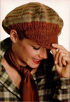 a woman wearing a brown tie and a knitted hat