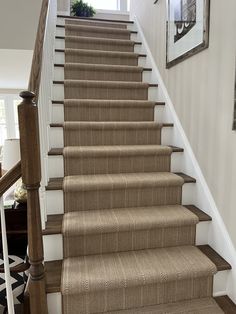 A patterned stair runner in neutral tones, installed on wooden steps, perfect for enhancing a modern home's aesthetic with both style and warmth. Runner Inspiration, Neutral Carpet, Space Rug, Craft Area, Rug Company, Stair Runner, Small Family, Home Improvement Projects, Herringbone