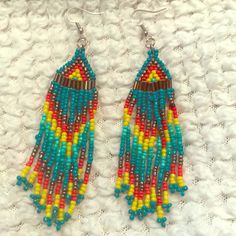 Native American Beaded Earrings Brand New. Gorgeous Turquoise And Other Color Mixed In To Complete These Gorgeous Earrings! Southwestern Green Earrings With Colorful Beads, Southwestern Style Green Earrings With Colorful Beads, Southwestern Green Beaded Dangling Earrings, Southwestern Green Beaded Dangle Earrings, Southwestern Turquoise Earrings With Colorful Beads, Turquoise Dangle Earrings With Large Beads, Southwestern Turquoise Beaded Fringe Earrings, Southwestern Turquoise Beaded Earrings, Turquoise Southwestern Beaded Fringe Earrings