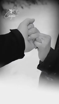 two people holding hands and touching each other