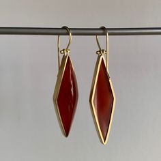 Rich vermillion color balances elegance with extravagance in these strikingly structured carnelians. 18k yellow gold Carnelian, 31.8ctw, 11mm x 38mm (7/16" x 1 1/2")Earrings hang 2 1/16" from the ear Each earring weighs 5.3g Modern Carnelian Gemstone Jewelry, Modern Carnelian Jewelry With Polished Finish, Red Faceted Carnelian Jewelry, Modern Red Carnelian Jewelry, Formal Red Carnelian Jewelry, Modern Carnelian Jewelry For Formal Occasions, Luxury Carnelian Jewelry For Formal Occasions, Yellow Gold Carnelian Jewelry With Polished Finish, Elegant Carnelian Dangle Earrings