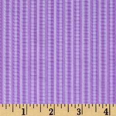 a ruler that is measuring the width of a purple background with vertical lines on it