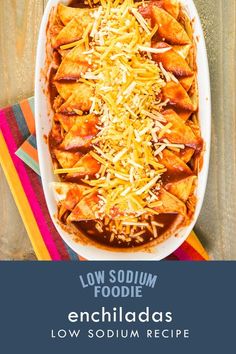 an enchiladas dish with shredded cheese on top and the title low soum foodie