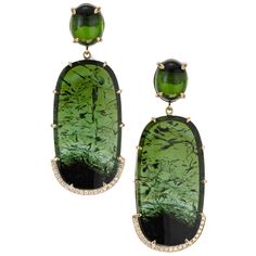 Natural tourmaline and diamond dangle earrings. Handmade in 18k yellow gold frames with oval tourmaline dangles accented with 44 round brilliant cut diamonds. Two oval cabochon tourmalines tops. Designed and crafted in the Peter Suchy workshop. 2 oval cabochon green tourmaline, approx. 11.03cts 2 oval green/black tourmaline slabs, approx. 49.64cts 44 round brilliant cut diamonds, F-G VS approx. .27cts 18k yellow gold Stamped: 18k Hallmark: P Suchy 19.8 grams Top to bottom: 52.2mm or 2 Inches Width: 20.8mm or 13/16 Inches Depth or thickness: 6.7mm Antique Wedding Bands, Diamond Sapphire Engagement Ring, Antique Engagement Rings Vintage, Gold Frames, Antique Bracelets, Vintage Sapphire, Gold Dangle Earrings, Diamond Engagement Rings Vintage, Diamond Dangle Earrings