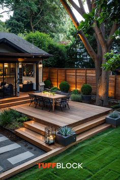 a backyard deck with steps leading up to the dining table and seating area, surrounded by grass