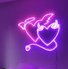 a neon sign with two hearts on it