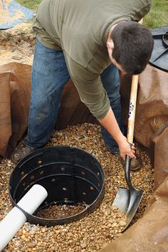 a man with a shovel is digging in the ground