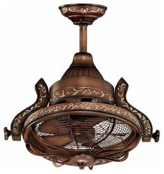 a ceiling fan with an intricate design on the front and back blades, attached to a light fixture