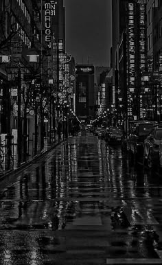 an empty city street at night in the rain