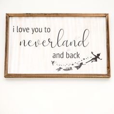 a sign hanging on the wall that says i love you to neverland and back