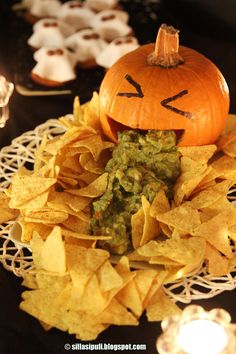 a plate with chips and a pumpkin on it