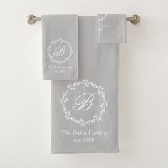 two personalized towels hanging on a towel rack